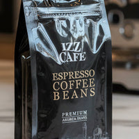 Packaged espresso coffee beans with 'Izz Cafe' branding on a white background